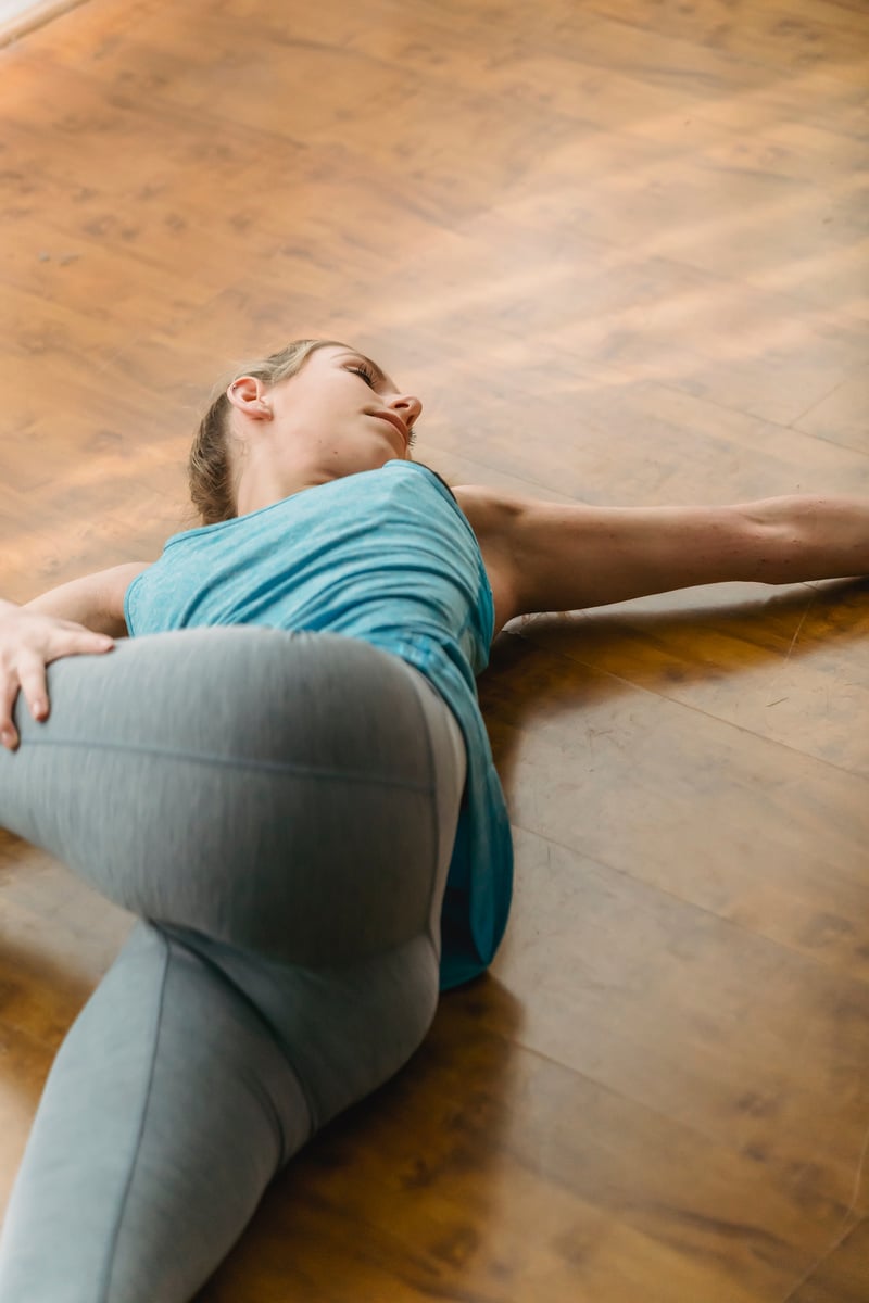 Energetic woman doing Revolved abdomen posture